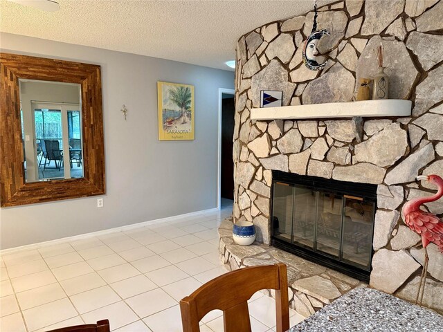 3652 Oak Grove Dr, Sarasota, FL 34243 - detailed view of a fireplace, a textured ceiling, and baseboards