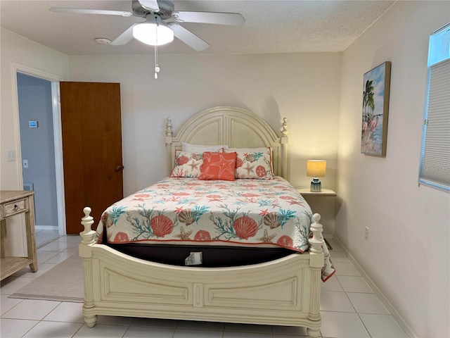 3652 Oak Grove Dr, Sarasota, FL 34243 - bedroom featuring light tile patterned flooring and a ceiling fan