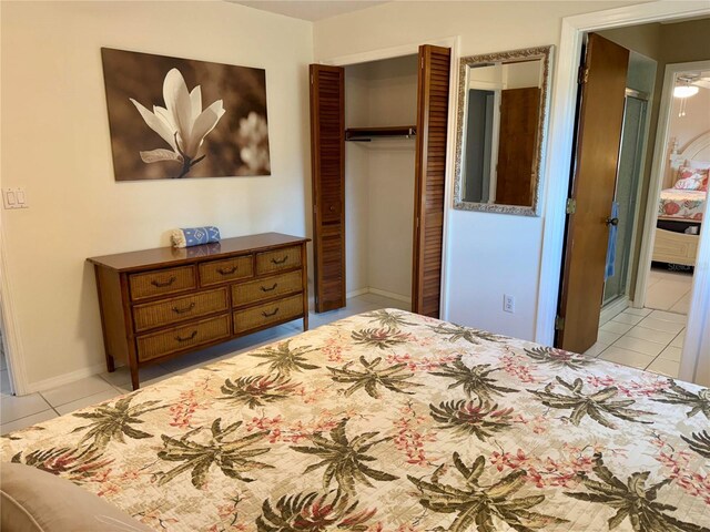 3652 Oak Grove Dr, Sarasota, FL 34243 - bedroom with light tile patterned floors, a closet, and baseboards