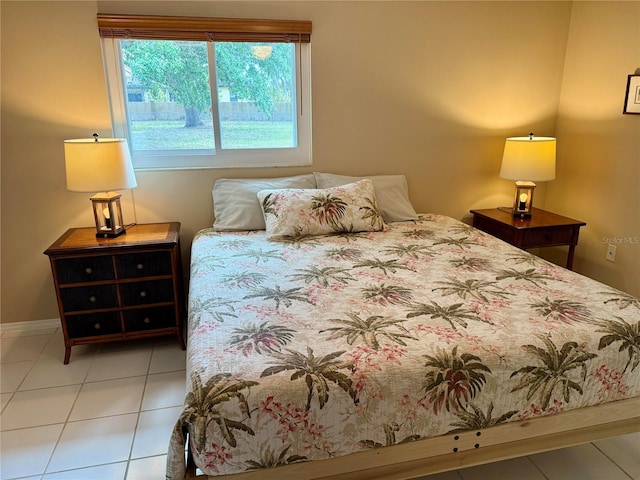 3652 Oak Grove Dr, Sarasota, FL 34243 - bedroom with tile patterned flooring and baseboards
