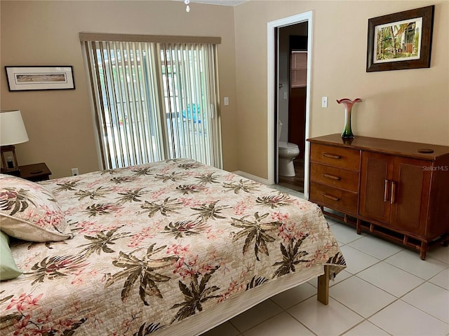 3652 Oak Grove Dr, Sarasota, FL 34243 - bedroom with light tile patterned flooring and ensuite bathroom