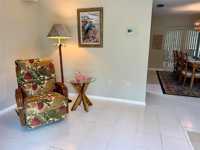 3652 Oak Grove Dr, Sarasota, FL 34243 - sitting room featuring tile patterned flooring and baseboards