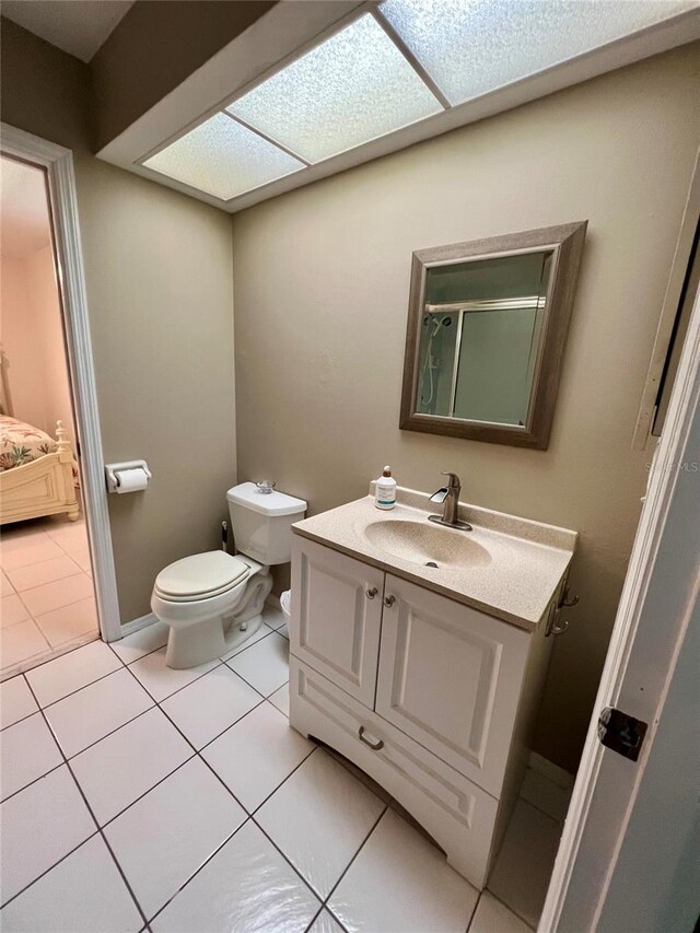 3652 Oak Grove Dr, Sarasota, FL 34243 - full bath featuring vanity, toilet, and tile patterned floors