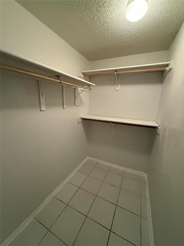 3652 Oak Grove Dr, Sarasota, FL 34243 - spacious closet with tile patterned floors