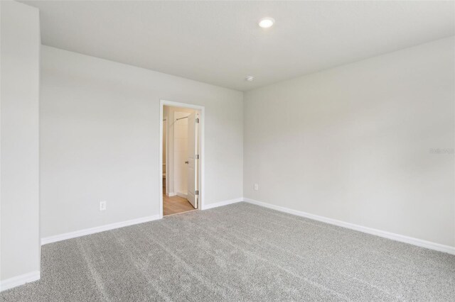 2320 E Newsome Rd, Plant City, FL 33565 - empty room featuring recessed lighting, light carpet, and baseboards