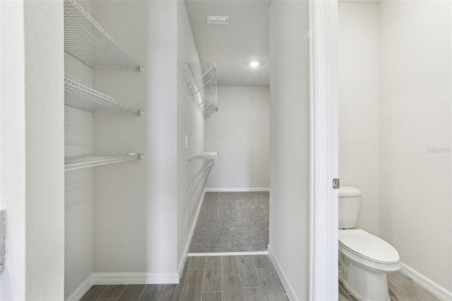 2320 E Newsome Rd, Plant City, FL 33565 - walk in closet with wood finished floors and visible vents