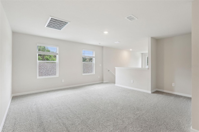 2320 E Newsome Rd, Plant City, FL 33565 - spare room featuring carpet floors, visible vents, and baseboards