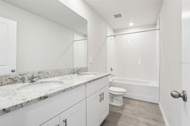 2320 E Newsome Rd, Plant City, FL 33565 - bathroom featuring toilet, a sink, visible vents, and double vanity