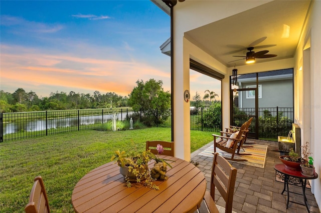 14749 Walcott Ave, Orlando, FL 32827 - view of patio with a water view, a fenced backyard, and a ceiling fan