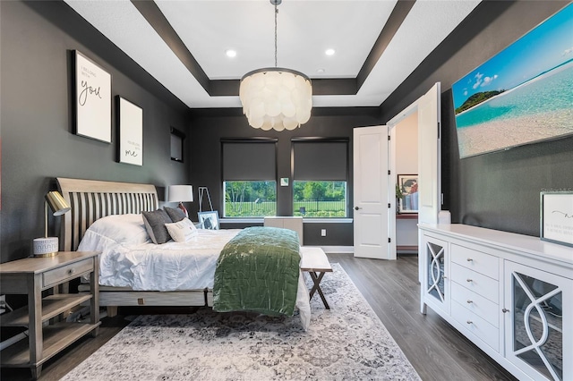 14749 Walcott Ave, Orlando, FL 32827 - bedroom featuring a chandelier, recessed lighting, a tray ceiling, and dark wood finished floors
