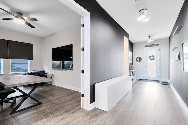 14749 Walcott Ave, Orlando, FL 32827 - office area with ceiling fan, wood finished floors, and baseboards