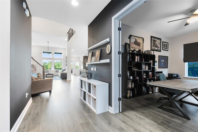 14749 Walcott Ave, Orlando, FL 32827 - office area with baseboards, arched walkways, ceiling fan, recessed lighting, and wood finished floors