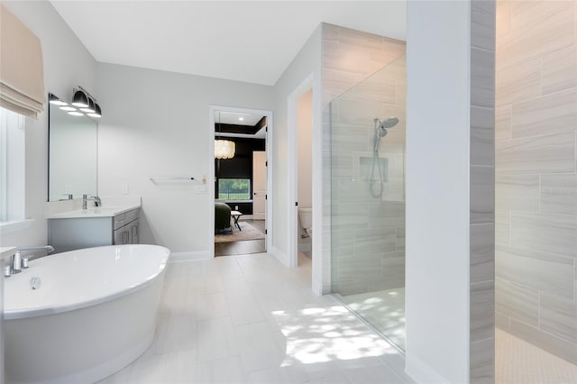 14749 Walcott Ave, Orlando, FL 32827 - ensuite bathroom with a soaking tub, connected bathroom, vanity, toilet, and walk in shower