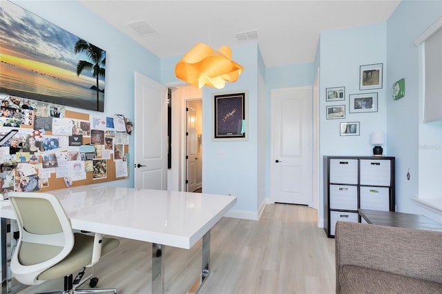 14749 Walcott Ave, Orlando, FL 32827 - home office featuring baseboards, visible vents, and light wood-style flooring