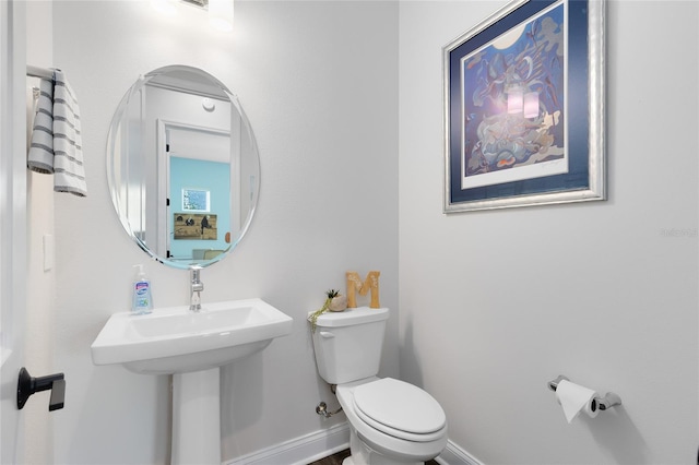 14749 Walcott Ave, Orlando, FL 32827 - bathroom featuring toilet and baseboards