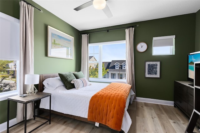 14749 Walcott Ave, Orlando, FL 32827 - bedroom with light wood-type flooring and a ceiling fan