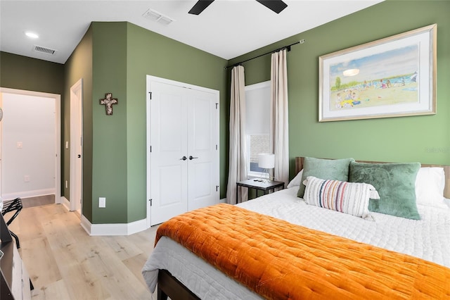 14749 Walcott Ave, Orlando, FL 32827 - bedroom with visible vents, light wood-style flooring, a closet, and baseboards