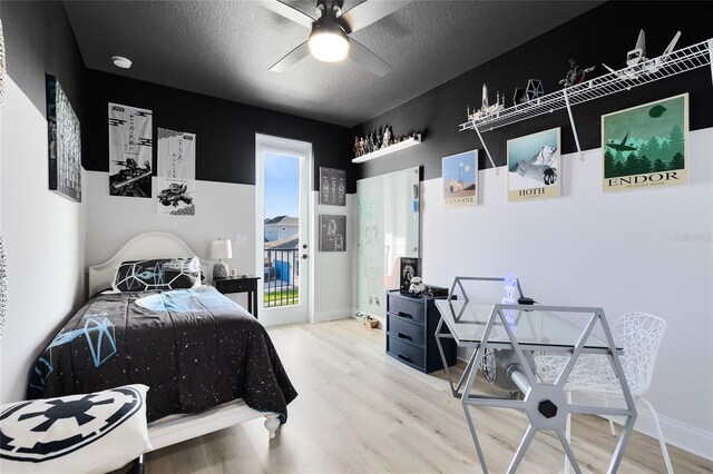 14749 Walcott Ave, Orlando, FL 32827 - bedroom with ceiling fan, baseboards, wood finished floors, and a textured ceiling