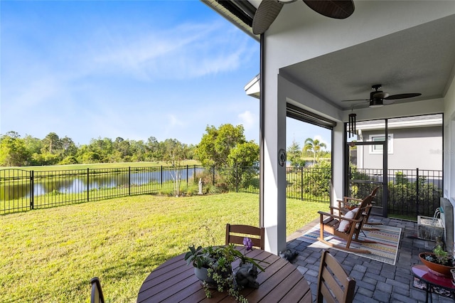 14749 Walcott Ave, Orlando, FL 32827 - sunroom featuring a water view, a ceiling fan, and outdoor dining space