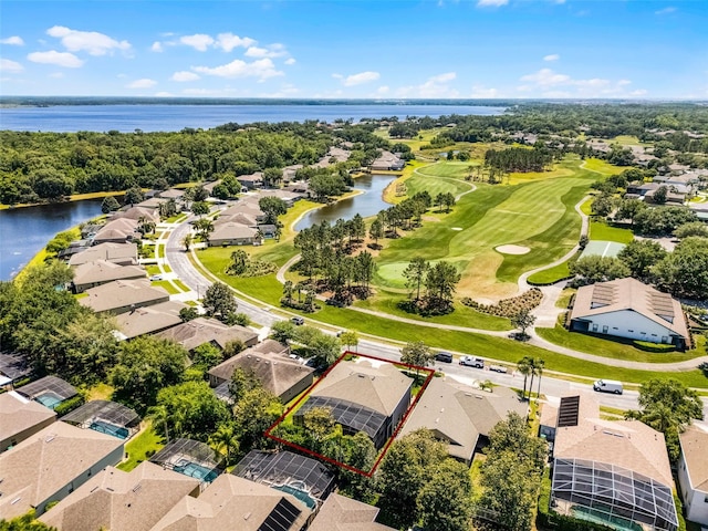 10033 Hart Branch Cir, Orlando, FL 32832 - aerial perspective of suburban area featuring a nearby body of water, property parcel outlined, and a local golf course