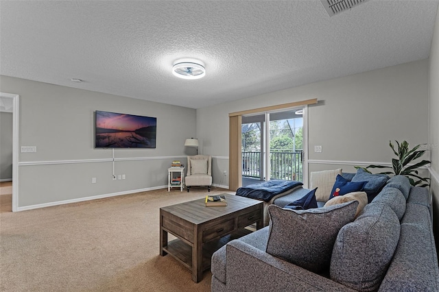 10033 Hart Branch Cir, Orlando, FL 32832 - carpeted living room with a textured ceiling and baseboards