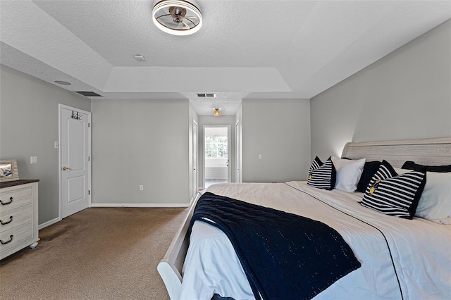 10033 Hart Branch Cir, Orlando, FL 32832 - bedroom with a tray ceiling, carpet flooring, baseboards, and a textured ceiling