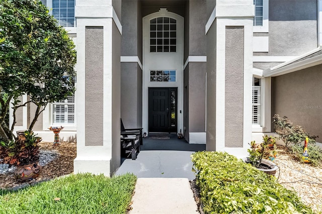 10033 Hart Branch Cir, Orlando, FL 32832 - view of exterior entry with stucco siding