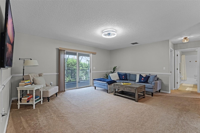 10033 Hart Branch Cir, Orlando, FL 32832 - living area featuring carpet flooring and a textured ceiling