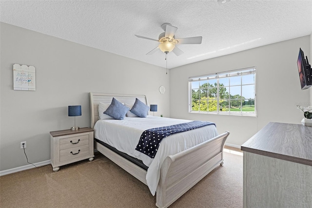 10033 Hart Branch Cir, Orlando, FL 32832 - carpeted bedroom with baseboards, a textured ceiling, and a ceiling fan