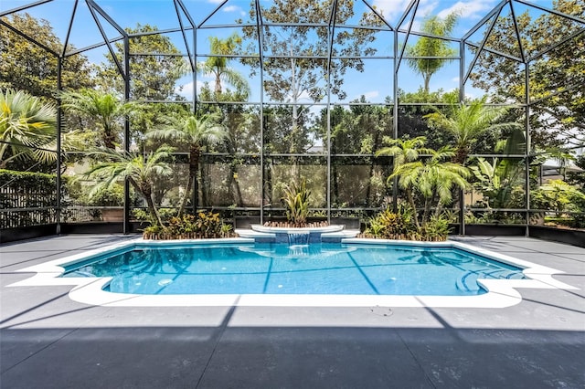 10033 Hart Branch Cir, Orlando, FL 32832 - outdoor pool featuring glass enclosure and a patio area