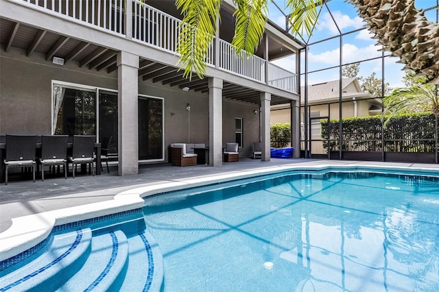 10033 Hart Branch Cir, Orlando, FL 32832 - view of swimming pool featuring a patio, outdoor lounge area, and glass enclosure