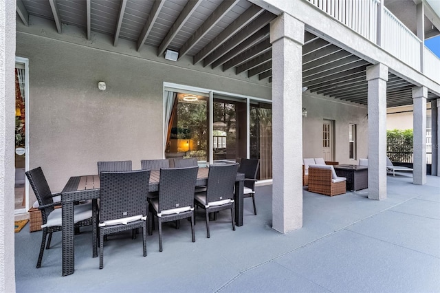 10033 Hart Branch Cir, Orlando, FL 32832 - view of patio / terrace featuring outdoor dining space and an outdoor living space