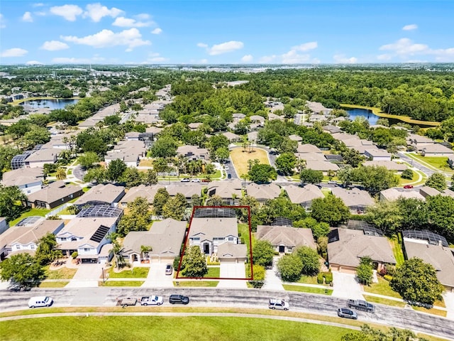 10033 Hart Branch Cir, Orlando, FL 32832 - aerial perspective of suburban area featuring property parcel outlined and a large body of water