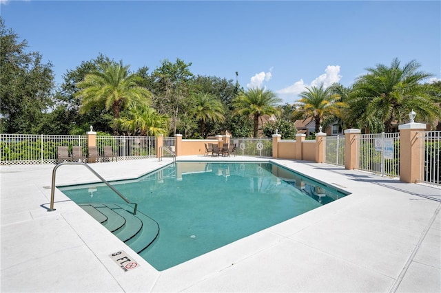 7420 Cypress Grove Rd Unit 132, Orlando, FL 32819 - community pool with a patio and view of scattered trees