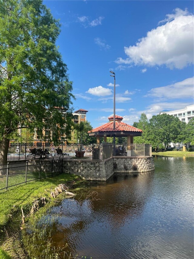 12539 Floridays Resort Dr Unit 208D, Orlando, FL 32821 - exterior space featuring a gazebo and fence