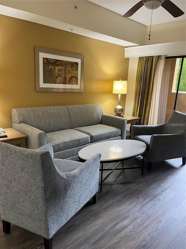 12539 Floridays Resort Dr Unit 208D, Orlando, FL 32821 - living room featuring a ceiling fan and wood finished floors