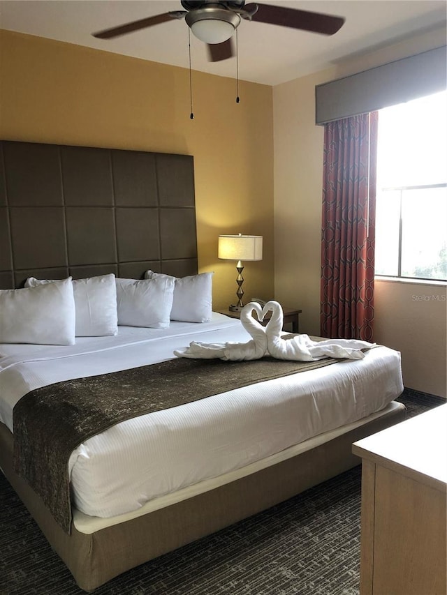 12539 Floridays Resort Dr Unit 208D, Orlando, FL 32821 - bedroom with a ceiling fan