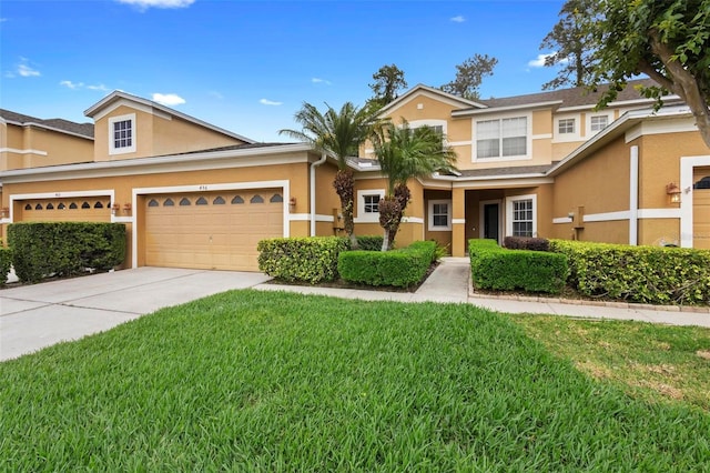 456 Harbor Winds Ct, Winter Springs, FL 32708 - view of front facade with an attached garage, concrete driveway, stucco siding, and a front yard