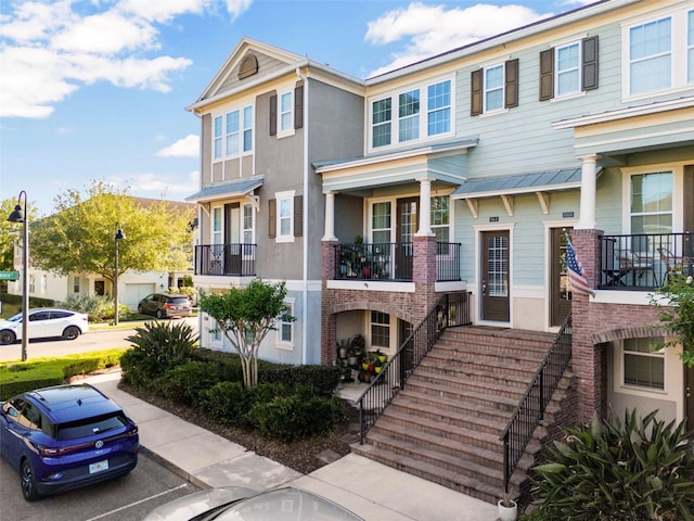 861 Taramundi Dr, Oviedo, FL 32765 - multi unit property featuring uncovered parking, stairs, and stucco siding