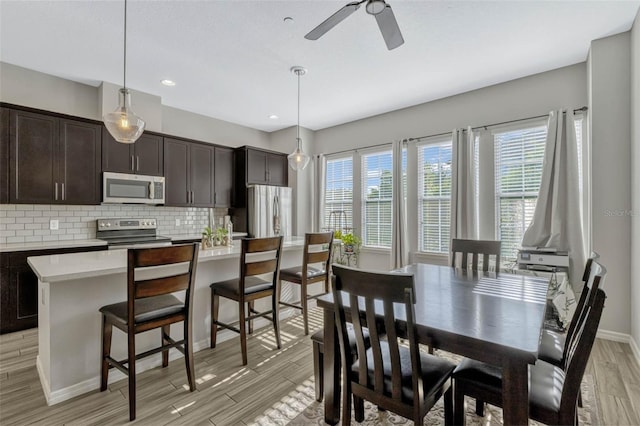 861 Taramundi Dr, Oviedo, FL 32765 - dining area with light wood finished floors, baseboards, recessed lighting, and ceiling fan