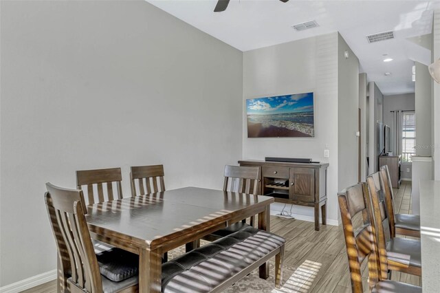 861 Taramundi Dr, Oviedo, FL 32765 - dining room with light wood finished floors, baseboards, a ceiling fan, and visible vents