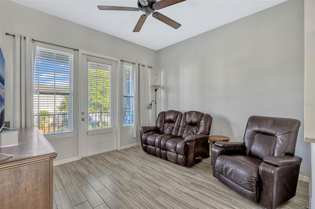 861 Taramundi Dr, Oviedo, FL 32765 - living area featuring baseboards, a ceiling fan, and wood tiled floor