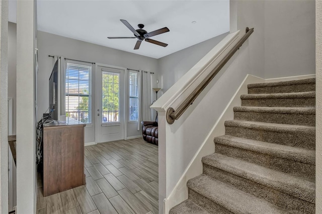 861 Taramundi Dr, Oviedo, FL 32765 - staircase featuring wood finish floors, a ceiling fan, and baseboards