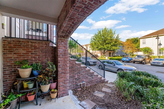 861 Taramundi Dr, Oviedo, FL 32765 - view of home's exterior featuring brick siding and stairs