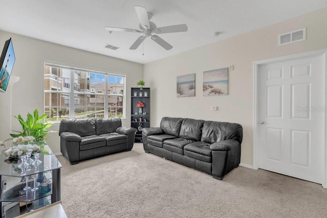 8213 Claire Ann Dr Unit 108, Orlando, FL 32825 - living room featuring visible vents, ceiling fan, carpet floors, and baseboards