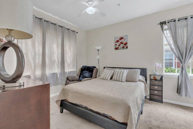8213 Claire Ann Dr Unit 108, Orlando, FL 32825 - bedroom with baseboards, a ceiling fan, and light colored carpet