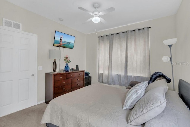 8213 Claire Ann Dr Unit 108, Orlando, FL 32825 - bedroom with visible vents, ceiling fan, and light colored carpet