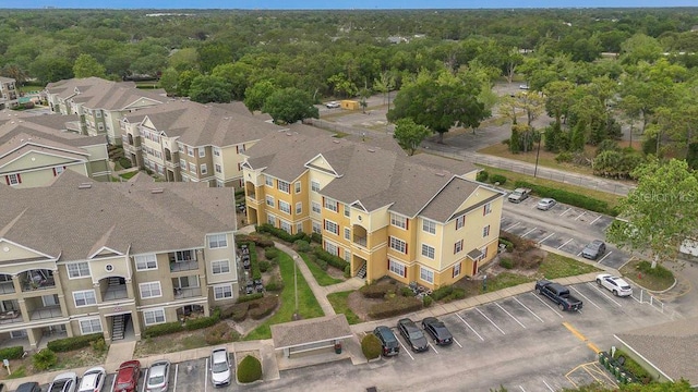 8213 Claire Ann Dr Unit 108, Orlando, FL 32825 - drone / aerial view featuring a forest view