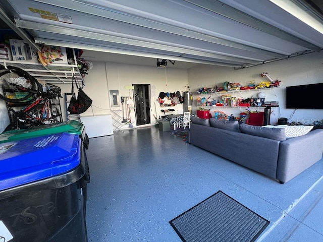 garage featuring electric panel and a garage door opener
