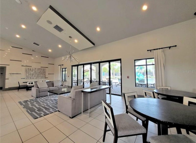 living room featuring visible vents, recessed lighting, high vaulted ceiling, and light tile patterned floors